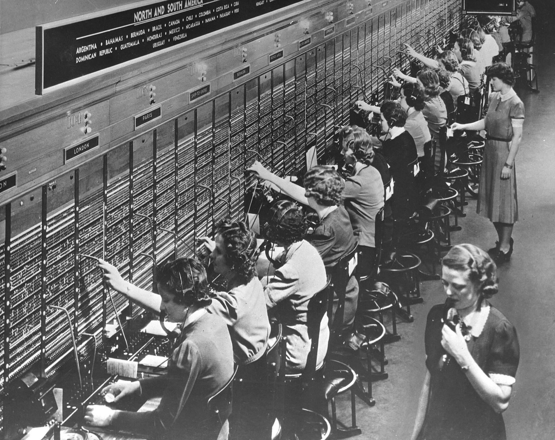 Rows of telephone operators at a Bell System switchboard